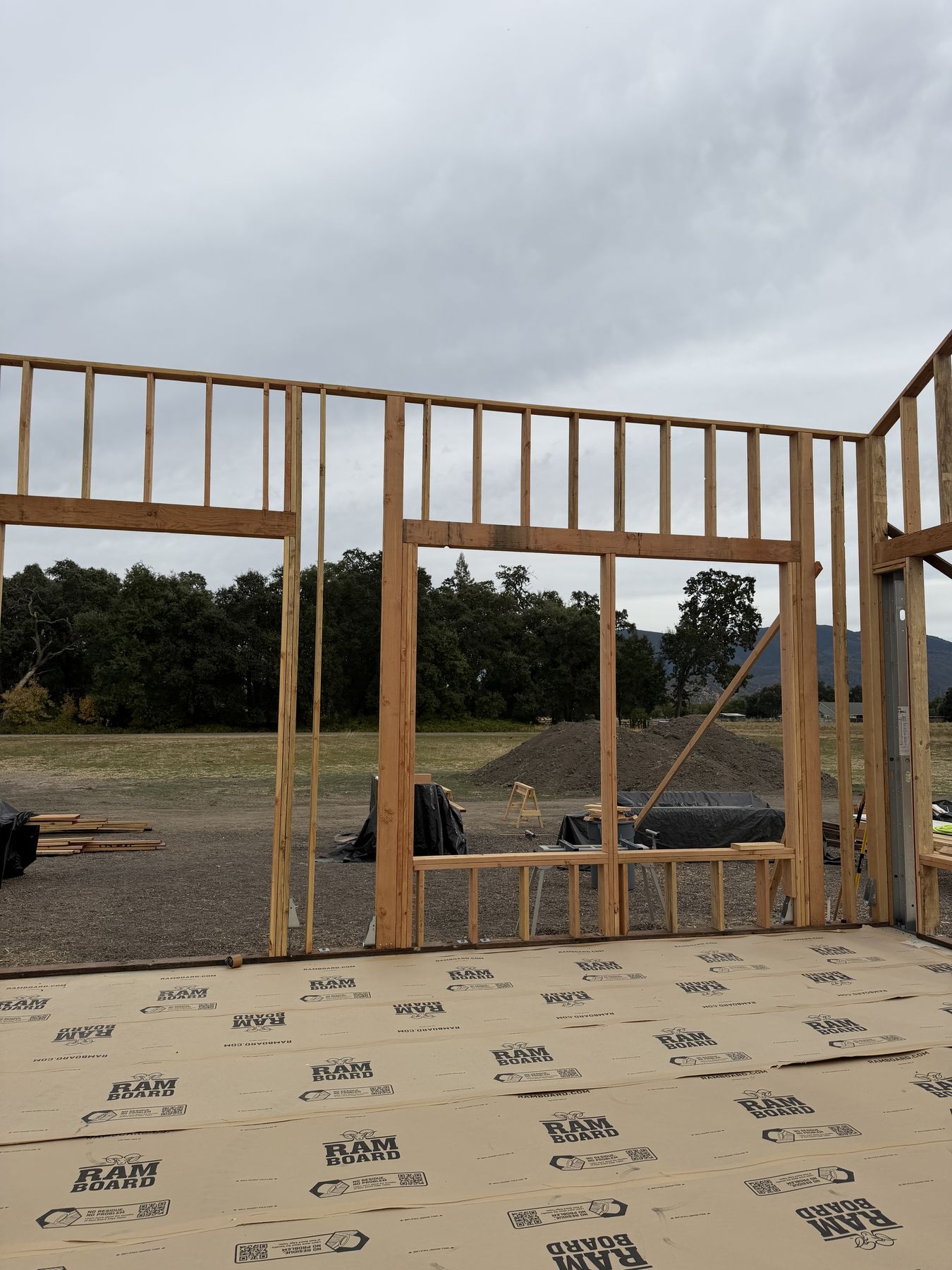 Framed walls and window openings on a design-build custom home in Kelseyville